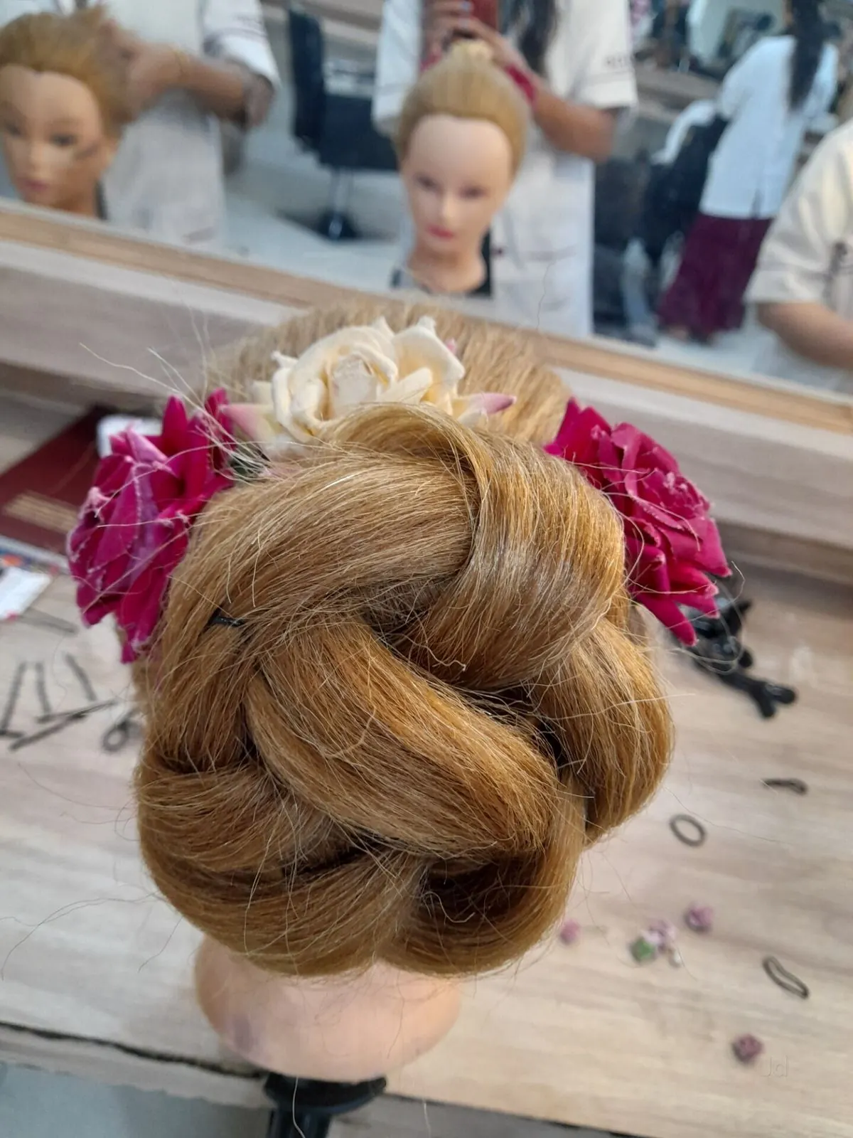 Braided bridal bun with roses