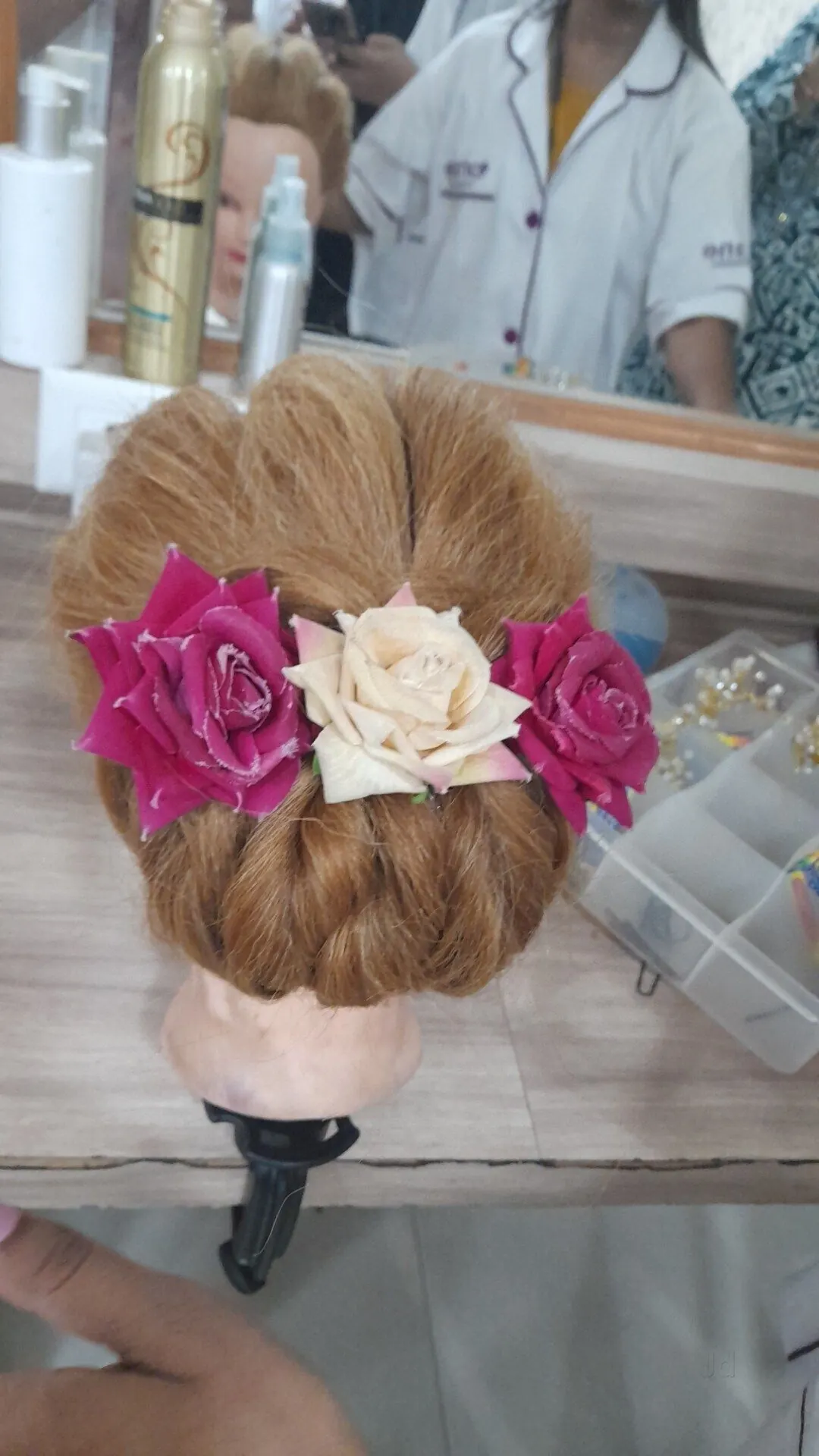 Bridal bun hairstyle with roses