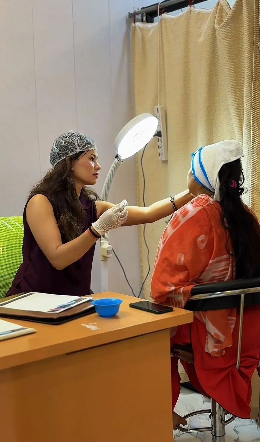 Certified cosmetologist treating a client at the salon